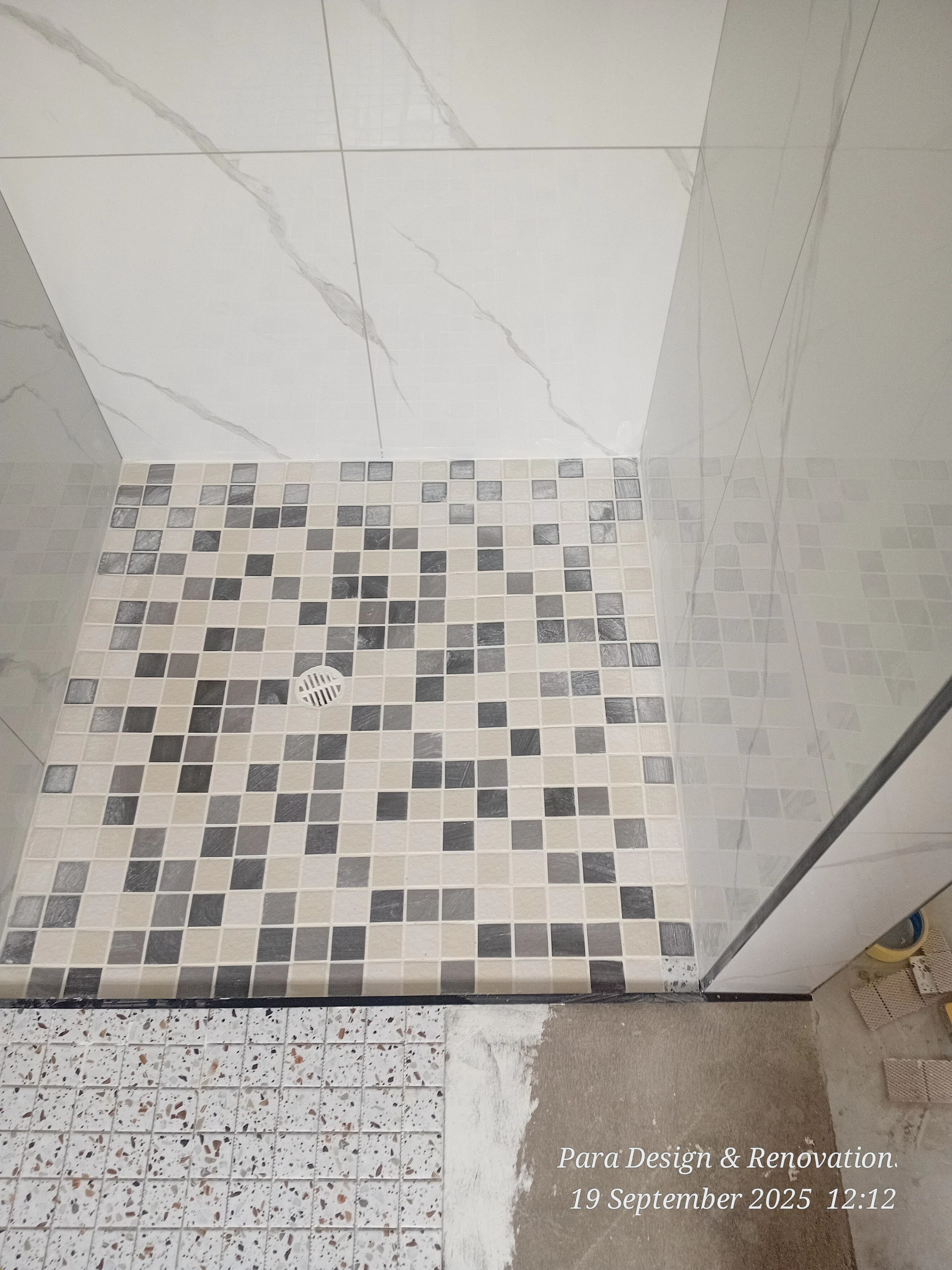 Feature wall tiling in modern bathroom